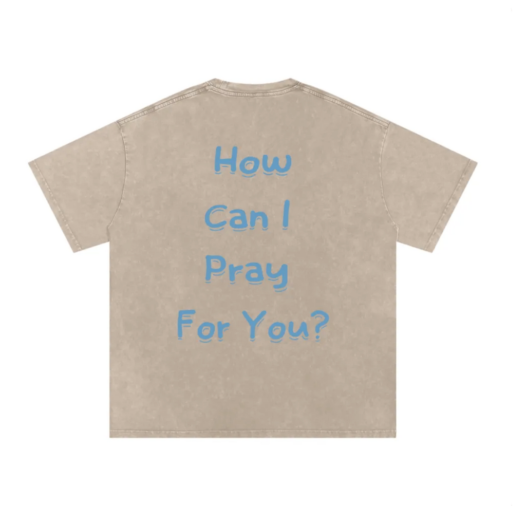 Beige t-shirt with blue text 'How Can I Pray For You?' on a white background